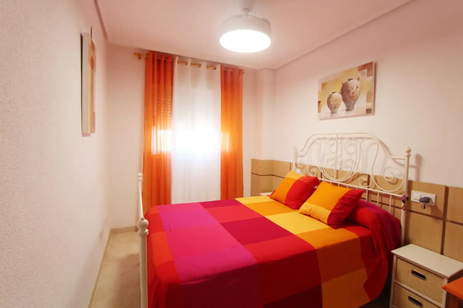 Dormitori de Apartament de lloguer en Cabanes amb Piscina comunitària