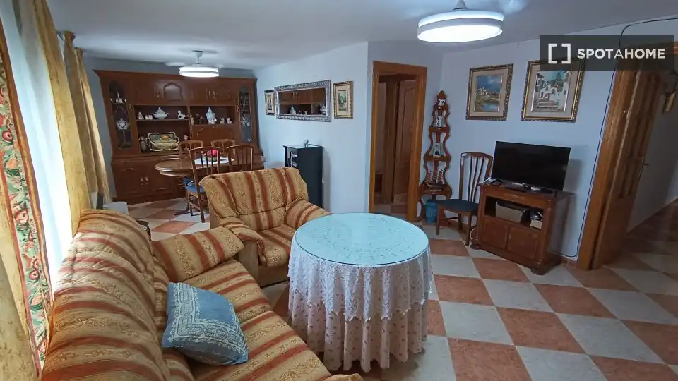 Sala d'estar de Apartament per a compartir en Fuente Vaqueros amb Aire condicionat, Terrassa i Moblat
