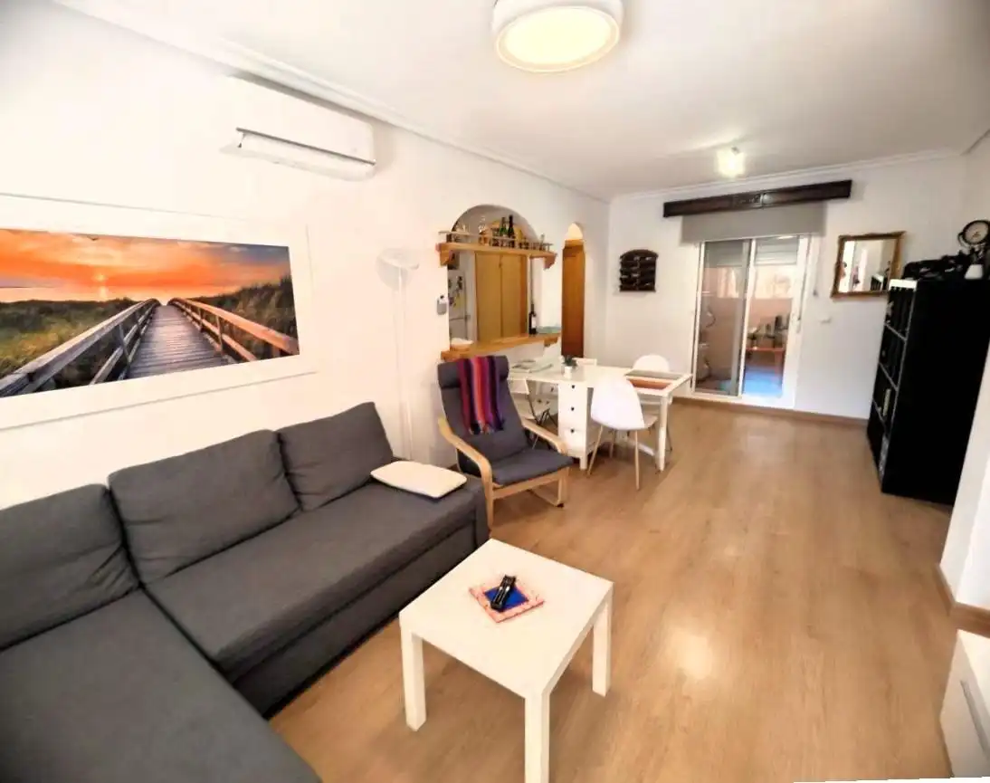 Sala d'estar de Casa adosada de lloguer en Santa Pola amb Aire condicionat, Parquet i Terrassa