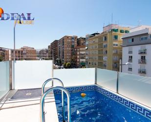 Swimming pool of Single-family semi-detached for sale in  Granada Capital  with Air Conditioner, Terrace and Swimming Pool