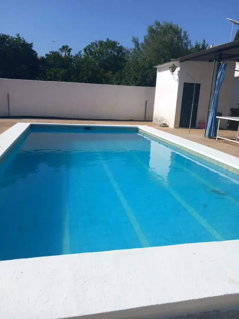 Swimming pool of Houses for sale in Sanlúcar la Mayor  with Air Conditioner, Private garden and Storage room