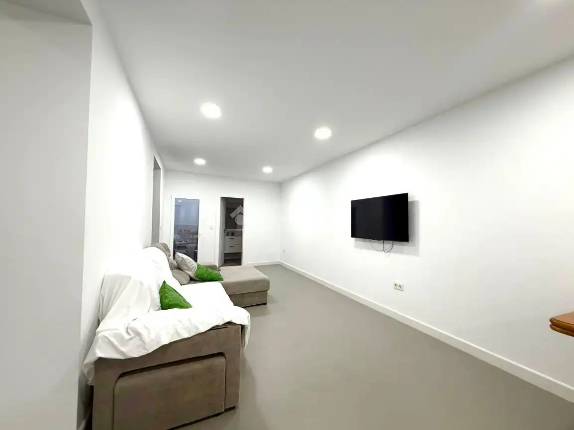 Sala de estar de Casa adosada en venta en Almería con Calefacción y Terraza