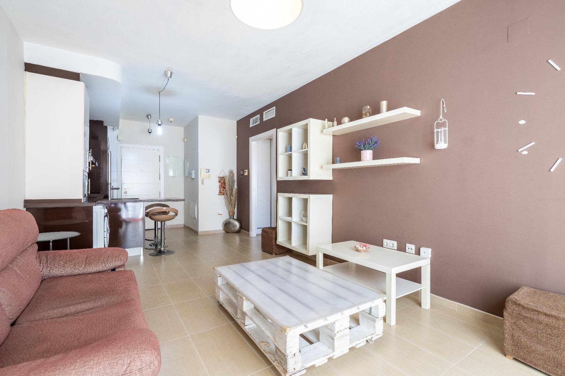 Living room of Flat for sale in  Almería Capital  with Air Conditioner, Private garden and Storage room