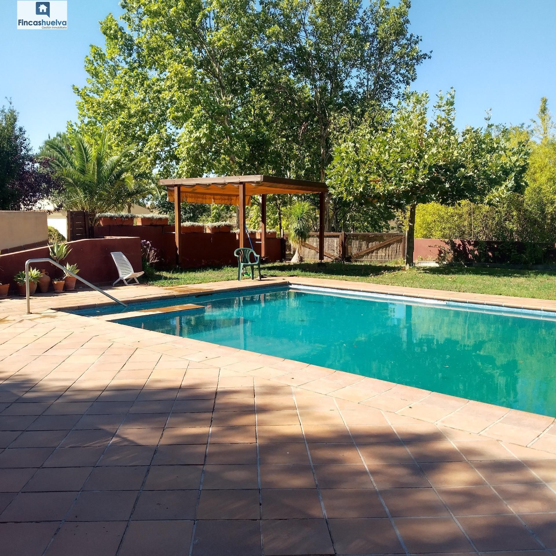 Swimming pool of Country house for sale in Moguer  with Air Conditioner, Heating and Storage room