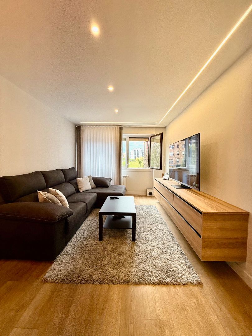 Living room of Apartment for sale in Gijón   with Heating, Private garden and Parquet flooring