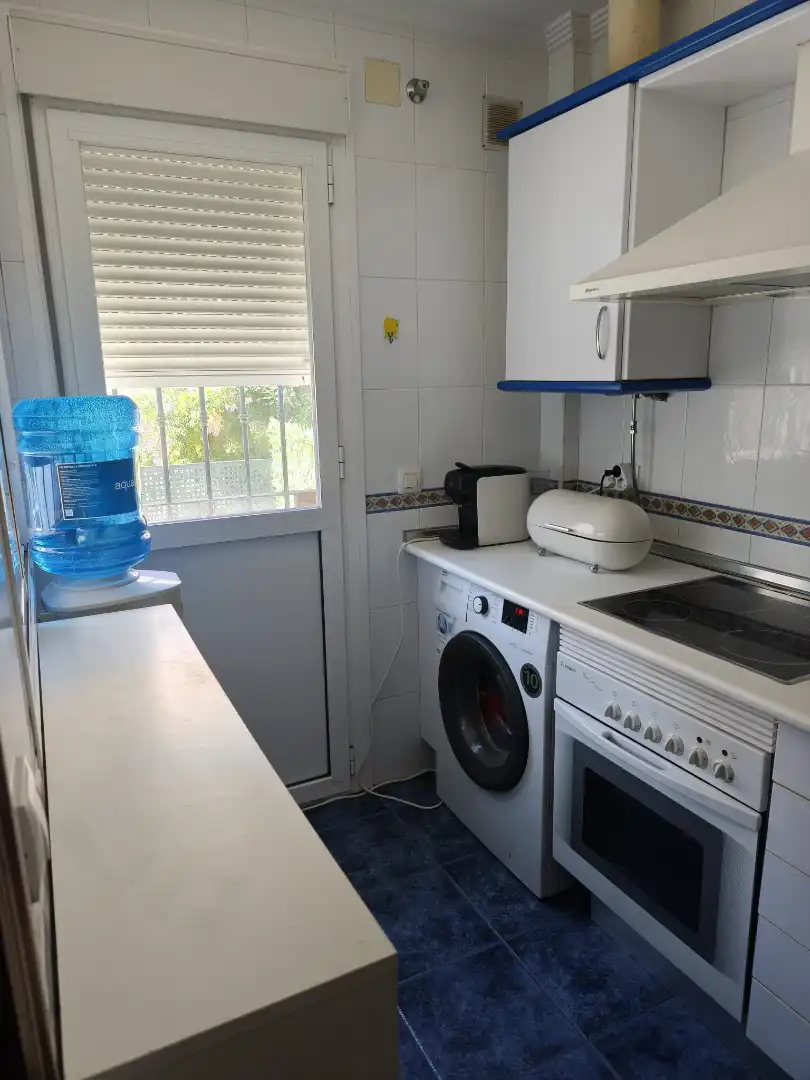 Cuina de Casa adosada en venda en El Portil amb Terrassa, Moblat i Piscina comunitària