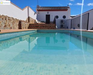 Swimming pool of House or chalet for sale in Gerena  with Air Conditioner, Terrace and Storage room