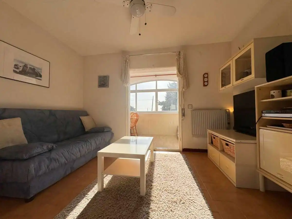 Sala de estar de Piso en venta en Roses con Piscina comunitaria