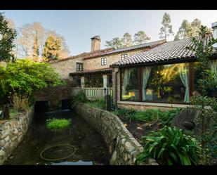 Vista exterior de Casa o xalet en venda en Rianxo amb Calefacció, Jardí privat i Parquet