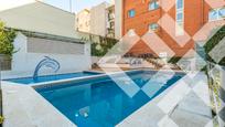 Swimming pool of Single-family semi-detached for sale in  Barcelona Capital  with Air Conditioner, Heating and Parquet flooring