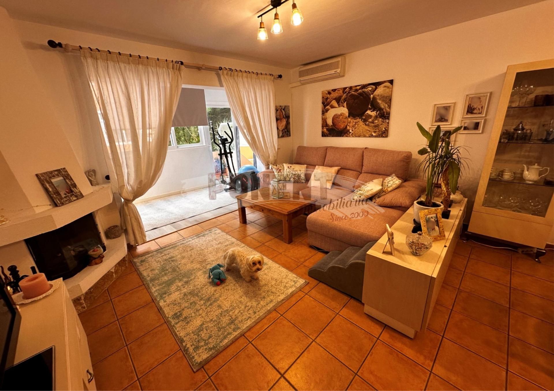 Sala d'estar de Planta baixa en venda en Santa Eulària des Riu amb Aire condicionat, Jardí privat i Terrassa