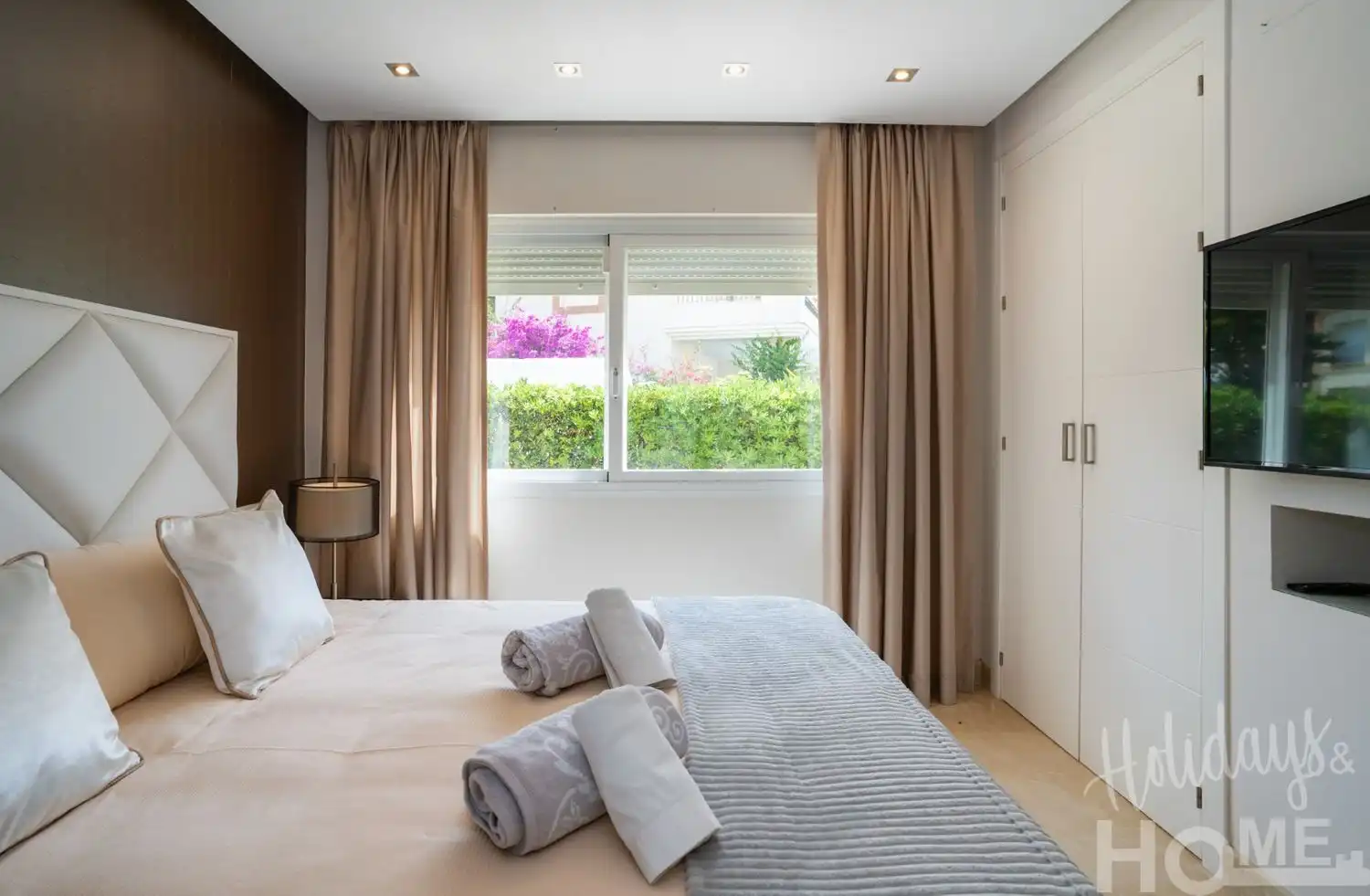 Dormitori de Pis de lloguer en Marbella amb Aire condicionat, Jardí privat i Terrassa
