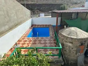 Piscina de Casa adosada en venda en Mogán amb Jardí privat, Piscina i Moblat