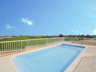 Swimming pool of Planta baja for sale in Sant Jaume d'Enveja  with Air Conditioner and Terrace