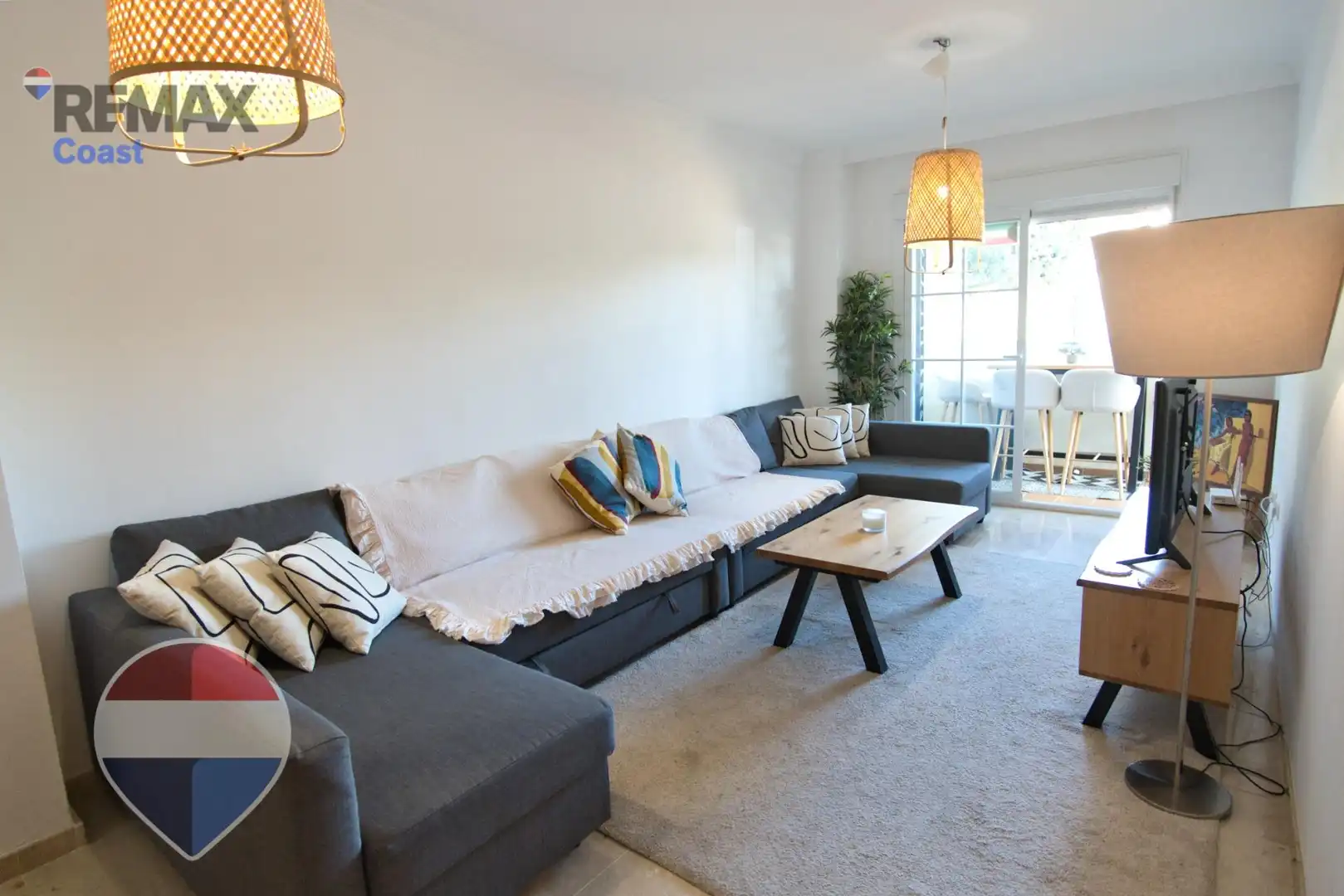 Wohnzimmer von Wohnung zum Verkauf in Benalmádena mit Klimaanlage, Privatgarten und Gemeinschaftspool