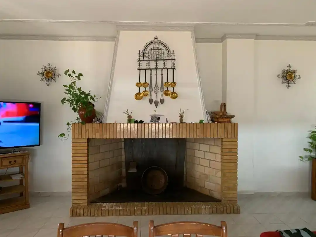 Sala d'estar de Casa adosada de lloguer en Añora amb Aire condicionat, Jardí privat i Traster