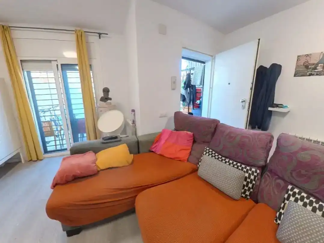 Sala d'estar de Casa adosada en venda en Cunit amb Aire condicionat i Balcó