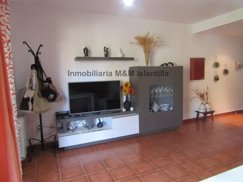 Sala de estar de Casa adosada en venta en Islantilla con Jardín privado, Terraza y Amueblado