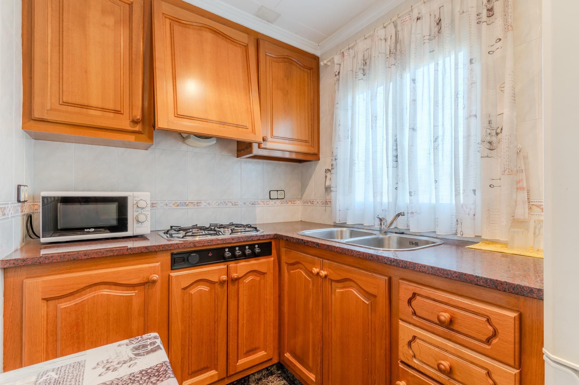 Cuina de Apartament en venda en Sarrià de Ter amb Calefacció