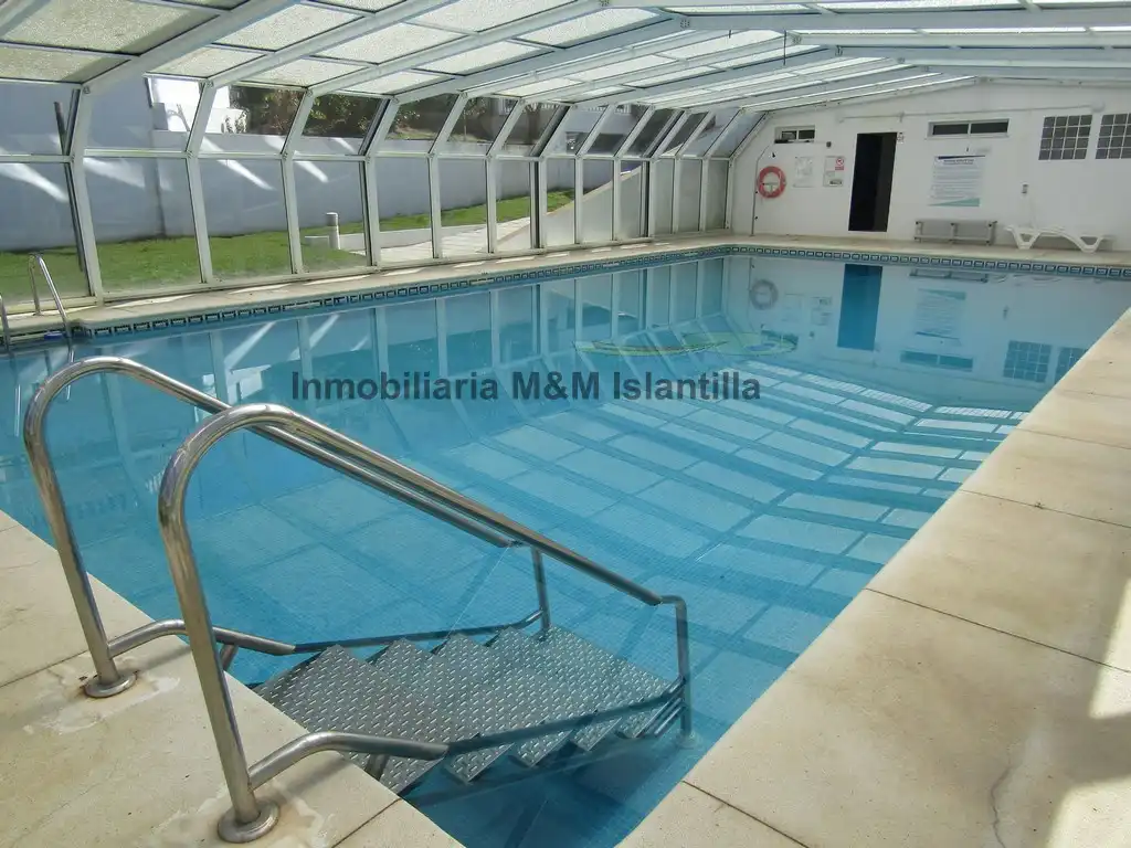 Piscina de Casa adosada en venta en Islantilla con Terraza, Trastero y Amueblado
