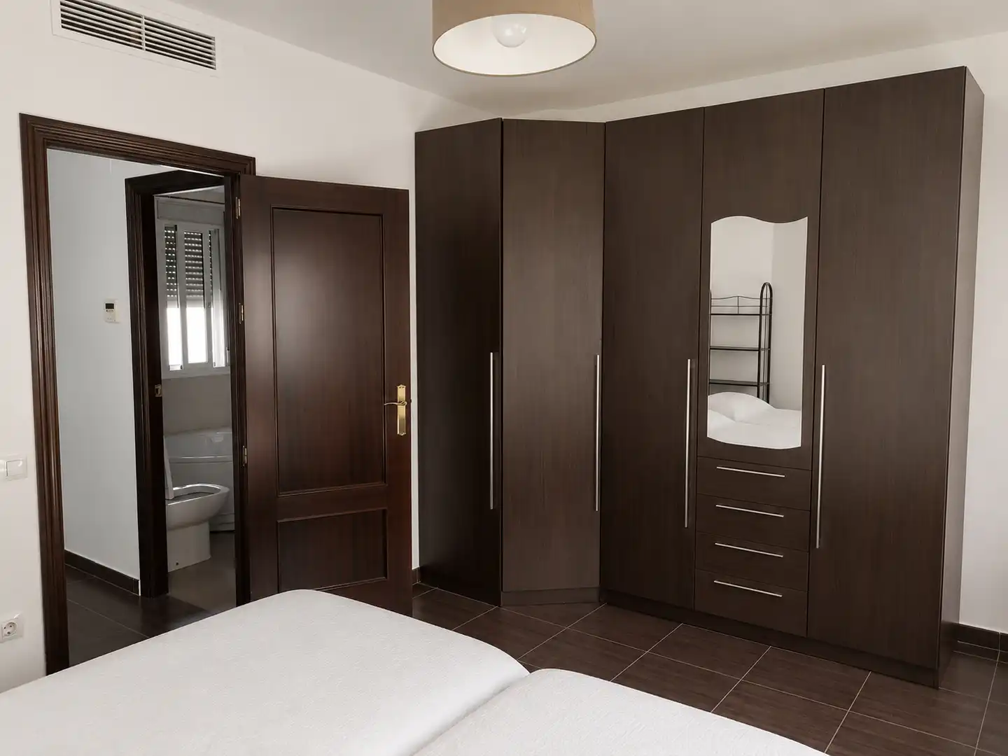Habitación de Casa adosada en venta en Lora del Río con Aire acondicionado, Terraza y Trastero