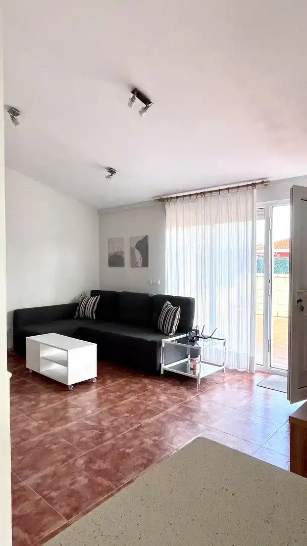 Sala d'estar de Casa adosada en venda en Medina de Pomar amb Jardí privat, Traster i Piscina