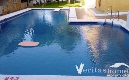 Swimming pool of Single-family semi-detached for sale in Roquetas de Mar