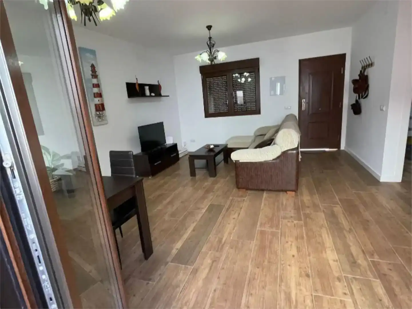 Sala d'estar de Casa adosada en venda en Chipiona amb Aire condicionat i Balcó
