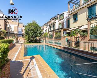 Swimming pool of Single-family semi-detached for sale in  Granada Capital  with Air Conditioner, Heating and Terrace