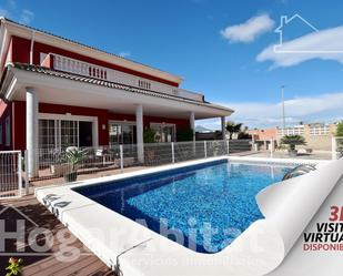 Vista exterior de Casa o xalet en venda en Daimús amb Aire condicionat, Terrassa i Piscina