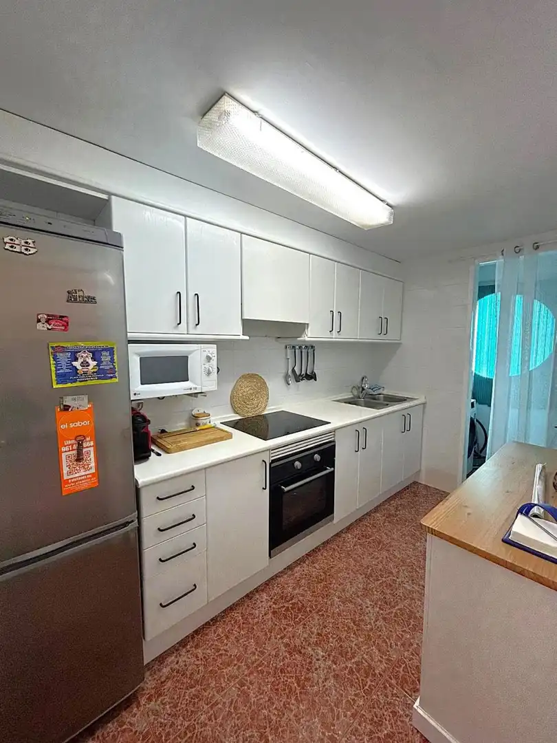 Cuina de Pis de lloguer en La Pobla de Farnals amb Aire condicionat, Jardí privat i Terrassa