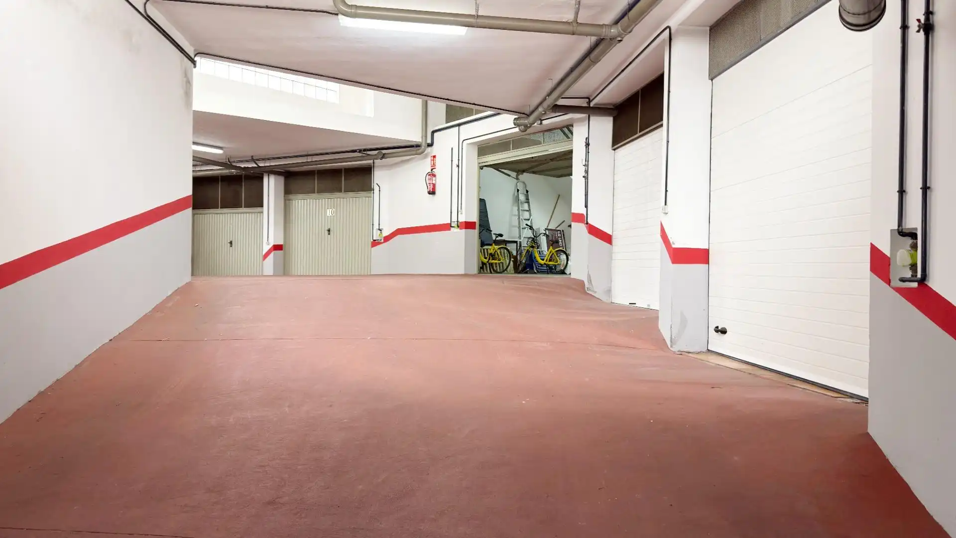 Parking de Casa adosada de alquiler en Punta Umbría con Terraza y Piscina comunitaria