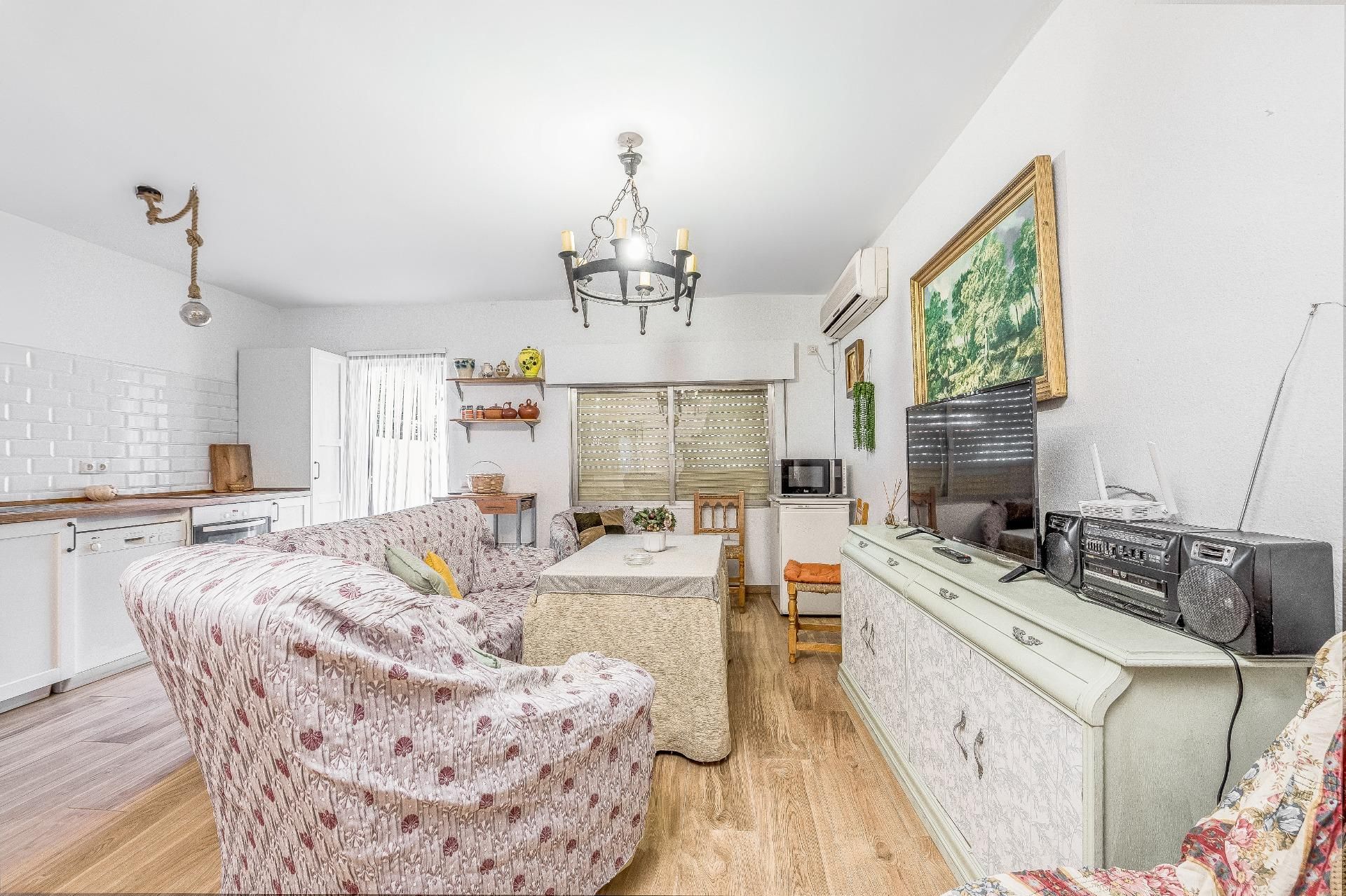 Sala d'estar de Casa adosada en venda en El Ronquillo amb Aire condicionat i Jardí privat