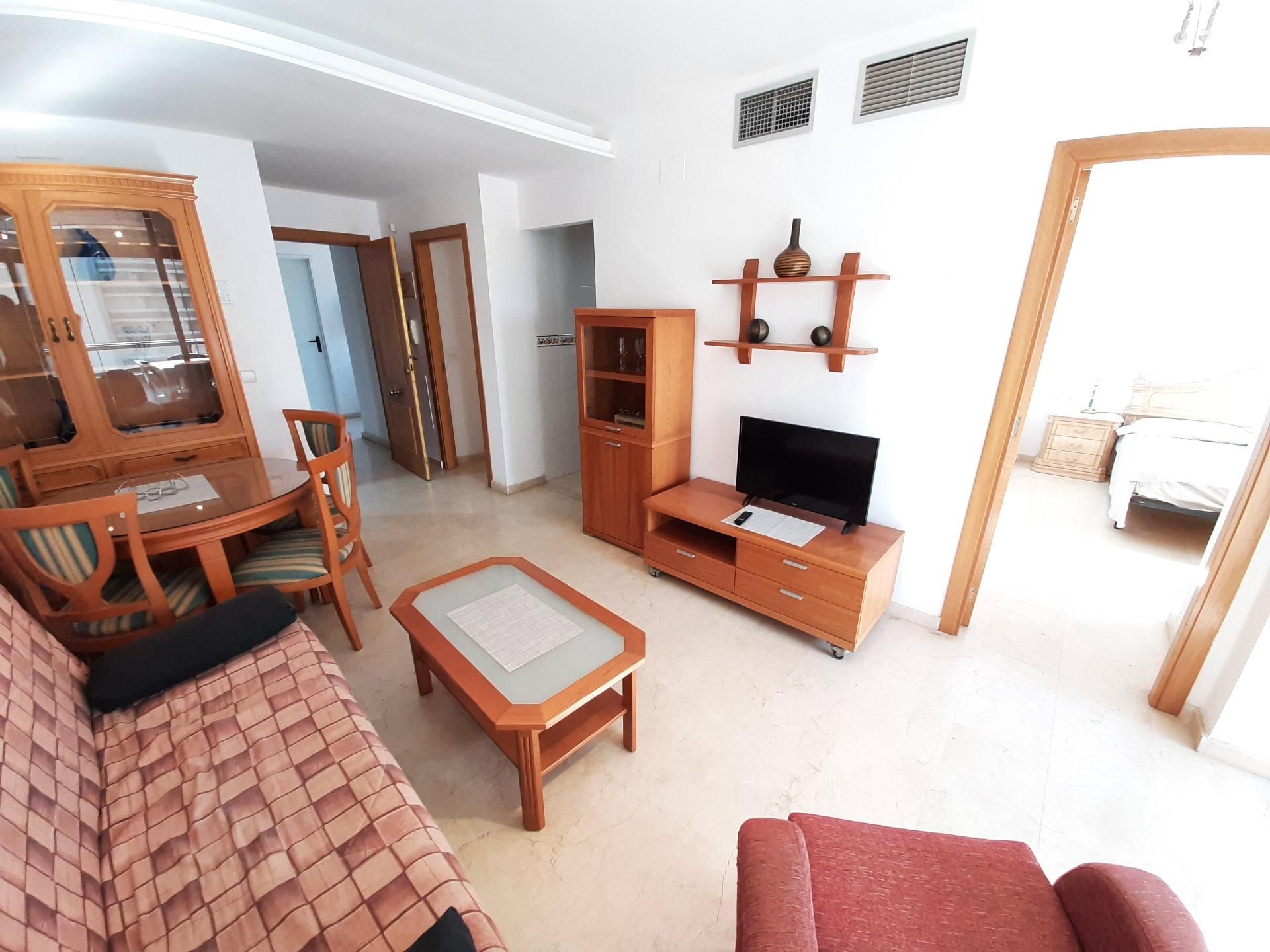 Sala d'estar de Apartament en venda en Benidorm amb Aire condicionat, Jardí privat i Terrassa