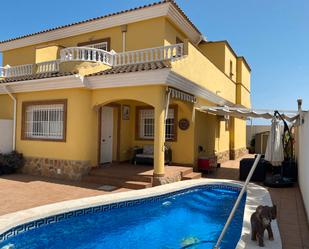 Exterior view of Single-family semi-detached for sale in Los Alcázares  with Air Conditioner, Heating and Private garden