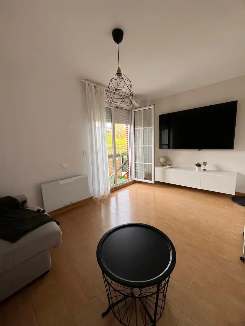 Sala de estar de Casa adosada en venta en Polanco con Calefacción, Jardín privado y Terraza