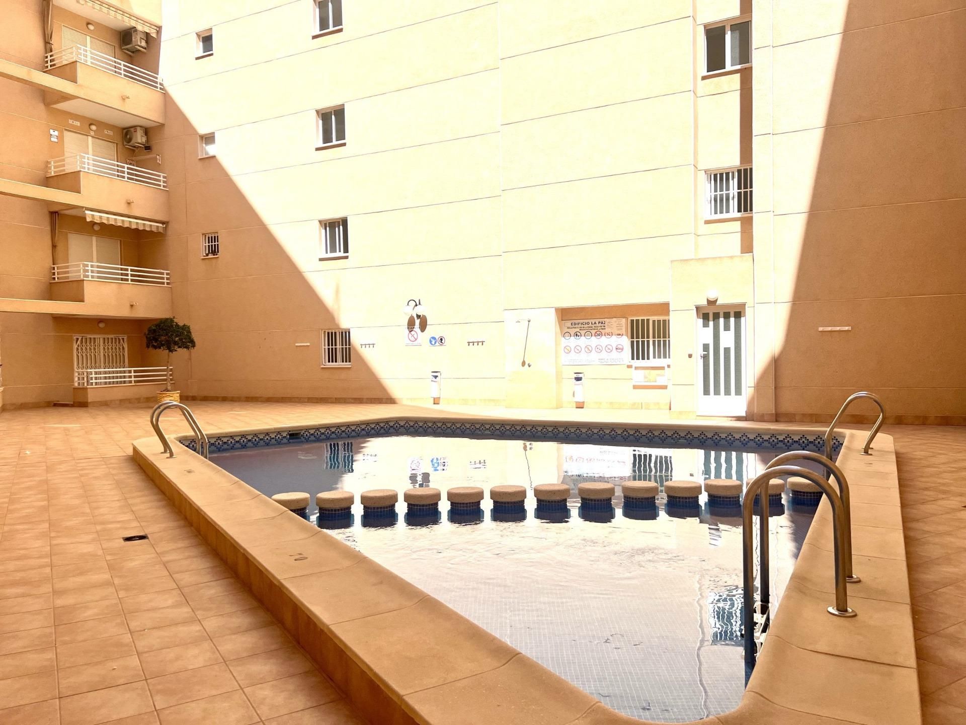 Swimming pool of Apartment for sale in Torrevieja  with Air Conditioner, Terrace and Balcony