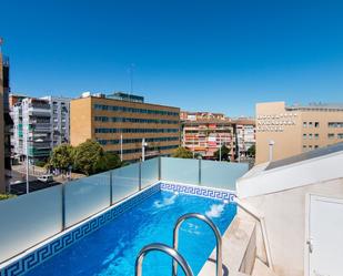 Swimming pool of Single-family semi-detached for sale in  Granada Capital  with Air Conditioner, Heating and Terrace