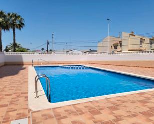 Swimming pool of Apartment for sale in Torrevieja  with Air Conditioner, Heating and Terrace