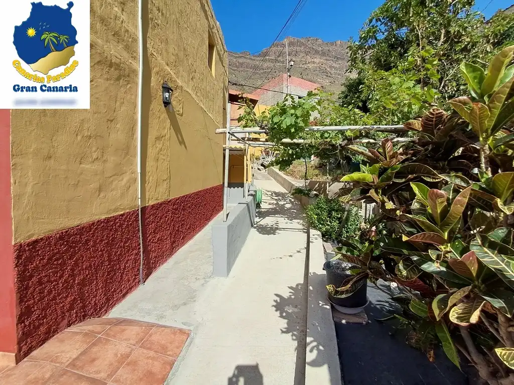 Außenansicht von Wohnung zum Verkauf in Mogán mit Privatgarten und Terrasse