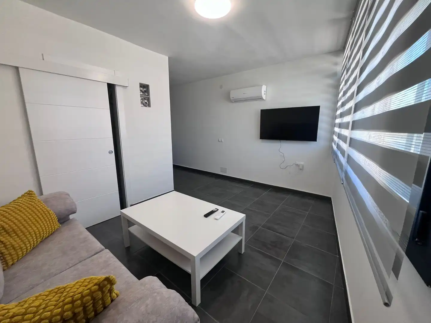 Sala d'estar de Dúplex de lloguer en Málaga amb Aire condicionat, Terrassa i Moblat
