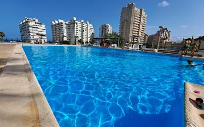 Swimming pool of Single-family semi-detached for sale in Cullera  with Air Conditioner, Terrace and Balcony