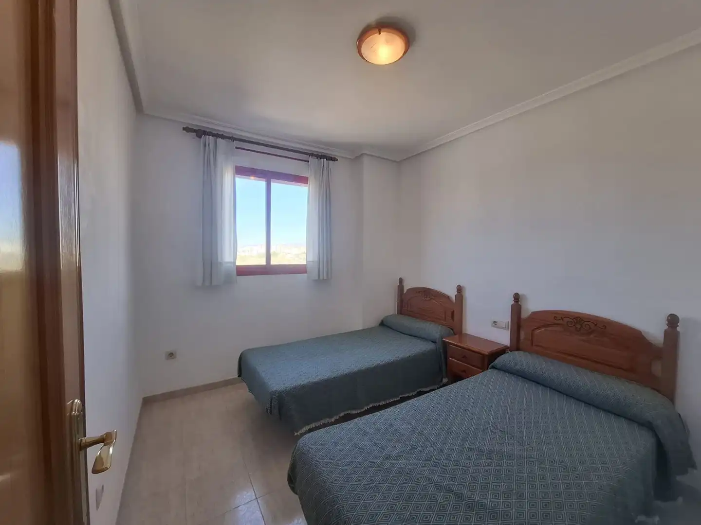 Dormitori de Pis de lloguer en Villajoyosa / La Vila Joiosa amb Aire condicionat, Terrassa i Piscina comunitària