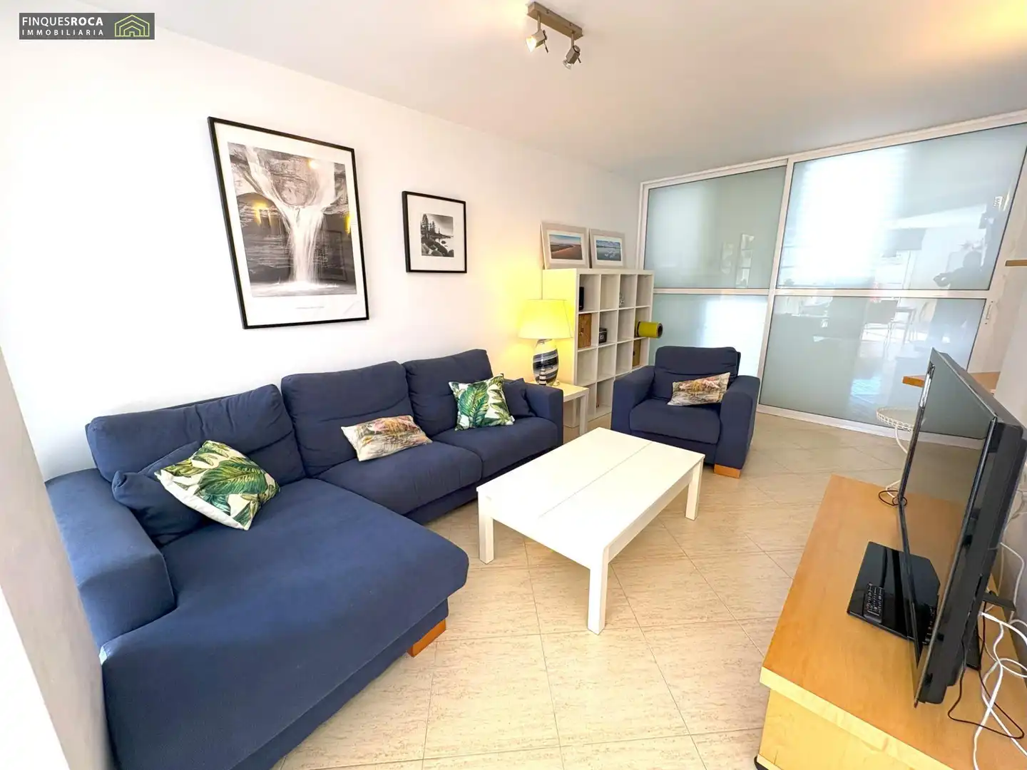 Sala d'estar de Casa adosada en venda en La Ràpita amb Aire condicionat, Jardí privat i Terrassa