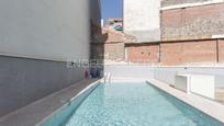 Swimming pool of Attic for sale in  Madrid Capital  with Air Conditioner, Terrace and Swimming Pool