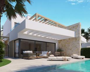 Vista exterior de Casa o xalet en venda en Monforte del Cid amb Aire condicionat, Jardí privat i Terrassa