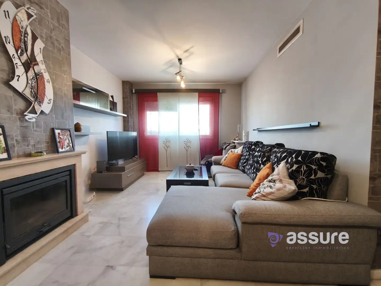 Sala de estar de Casa adosada en venta en Huelva con Aire acondicionado, Calefacción y Jardín privado