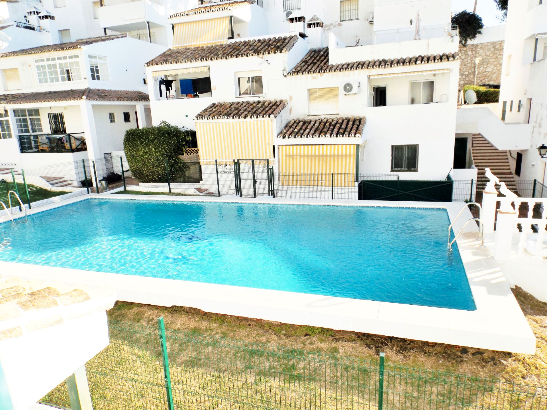 Swimming pool of Duplex for sale in Benalmádena  with Air Conditioner, Heating and Terrace