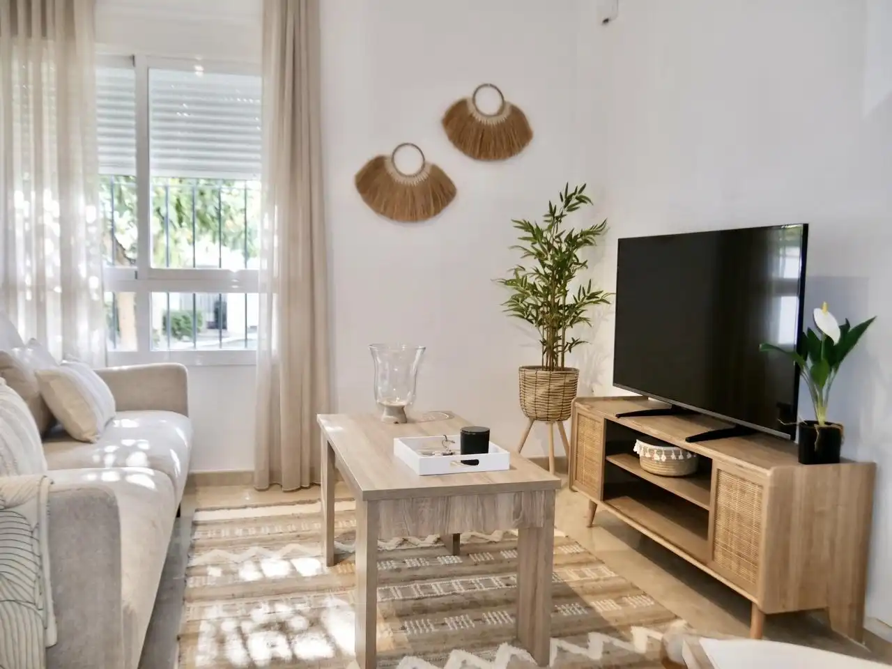 Sala d'estar de Apartament en venda en Sevilla amb Aire condicionat, Terrassa i Moblat