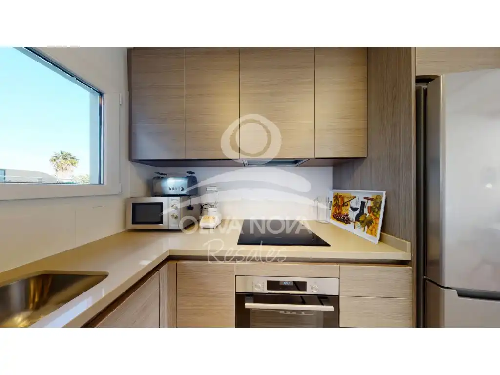 Cuina de Apartament en venda en Oliva amb Aire condicionat, Jardí privat i Piscina